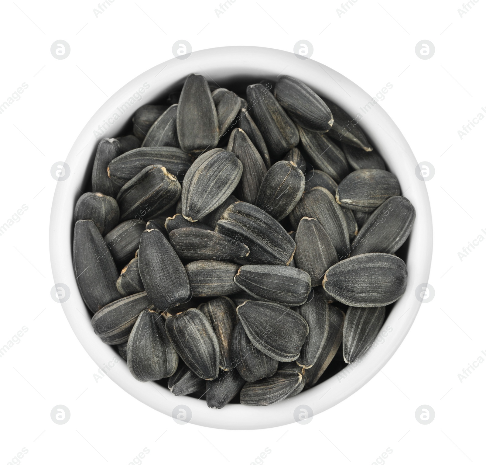 Sunflower seeds in bowl isolated on white, top view Photo of Sunflower seeds in bowl isolated on white, top view