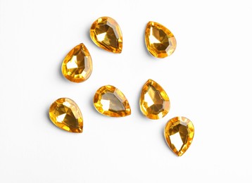 Beautiful gemstones on white background, top view Image of Beautiful gemstones on white background, top view