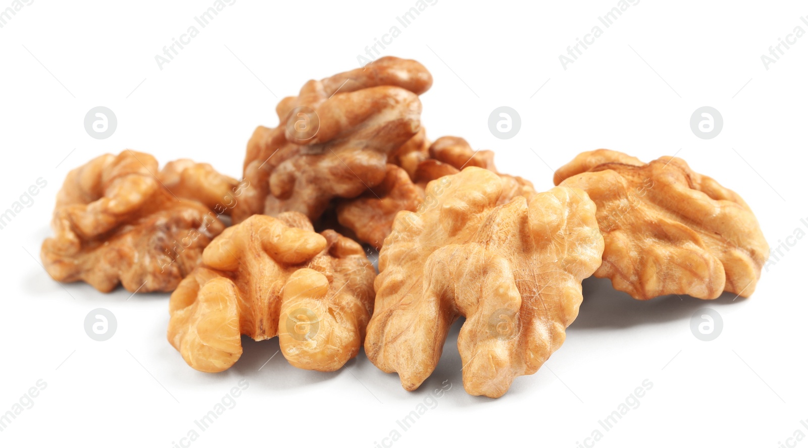 Pile of peeled walnuts on white background Photo of Pile of peeled walnuts on white background