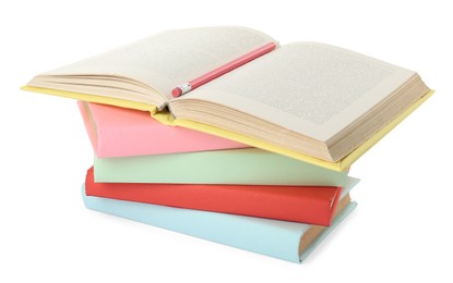 Many colorful hardcover books with pencil on white background Photo of Many colorful hardcover books with pencil on white background