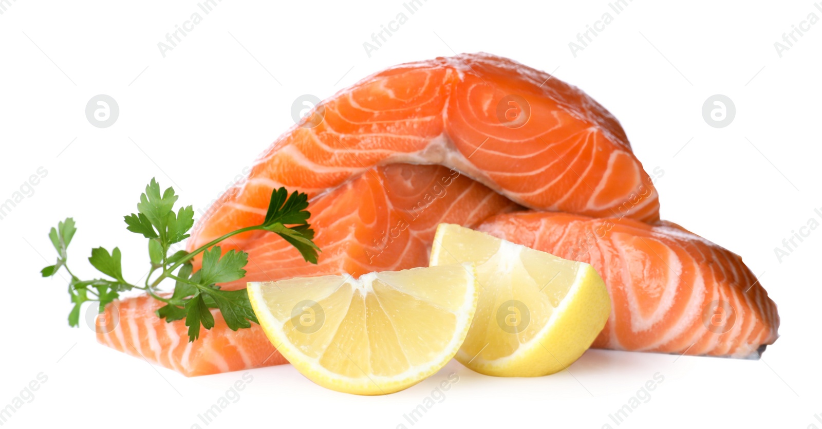 Fresh raw salmon with parsley and lemon on white background. Fish delicacy Photo of Fresh raw salmon with parsley and lemon on white background. Fish delicacy
