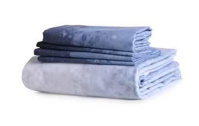 Stack of clean bed linen isolated on white Photo of Stack of clean bed linen isolated on white