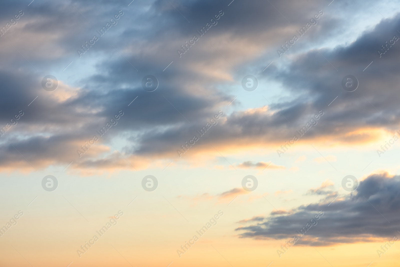 Picturesque view of beautiful sky with clouds at sunset Photo of Picturesque view of beautiful sky with clouds at sunset