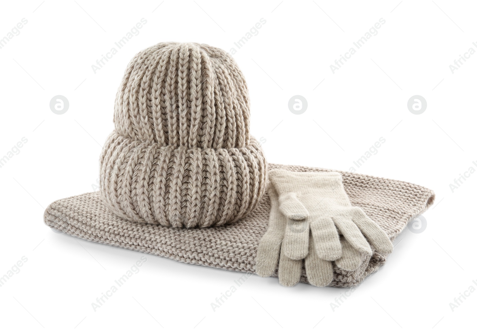 Photo of Woolen gloves, hat and scarf on white background. Winter clothes