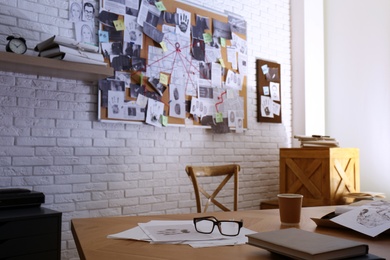 Detective office interior with workplace and investigation board Photo of Detective office interior with workplace and investigation board