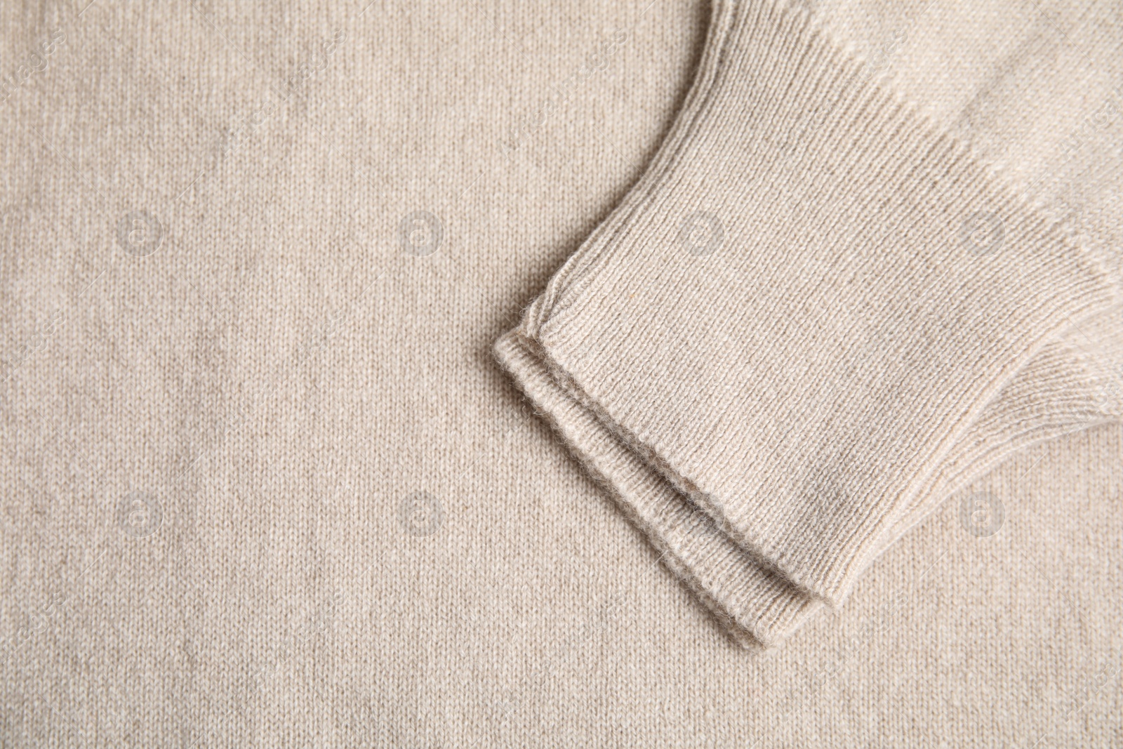 Warm cashmere sweater as background, top view Photo of Warm cashmere sweater as background, top view