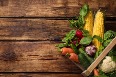 Many different vegetables on wooden table, top view. Space for text Photo of Many different vegetables on wooden table, top view. Space for text