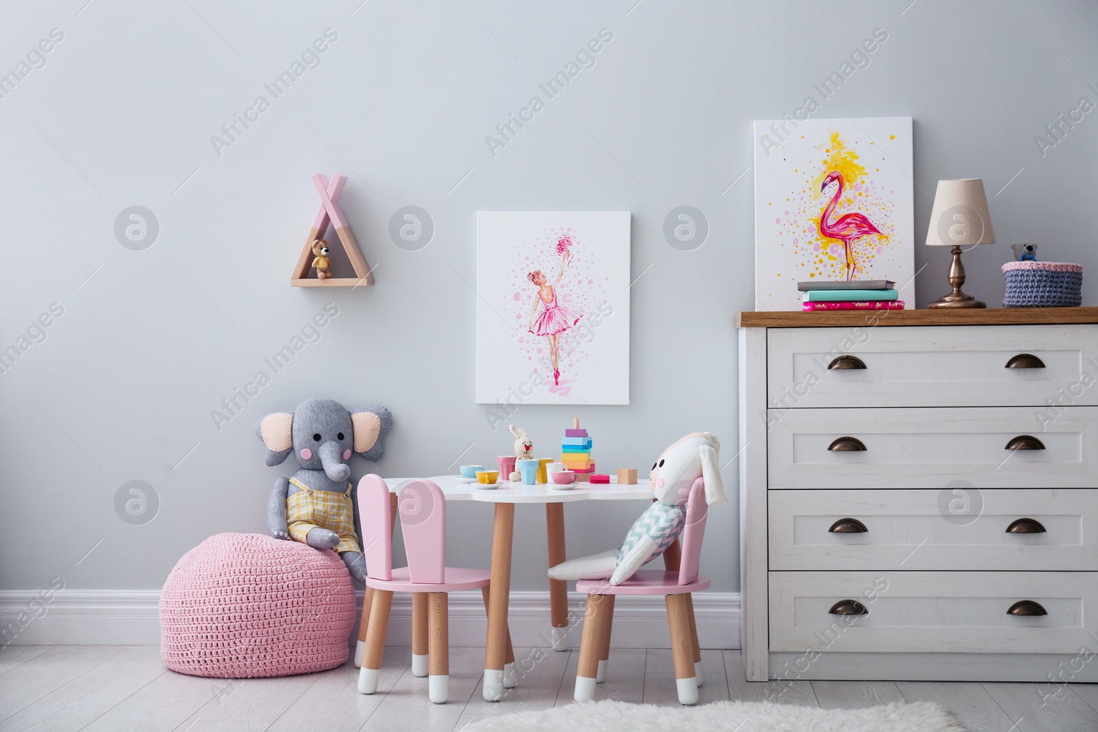 Children's room with modern furniture and pictures. Interior design Photo of Children's room with modern furniture and pictures. Interior design