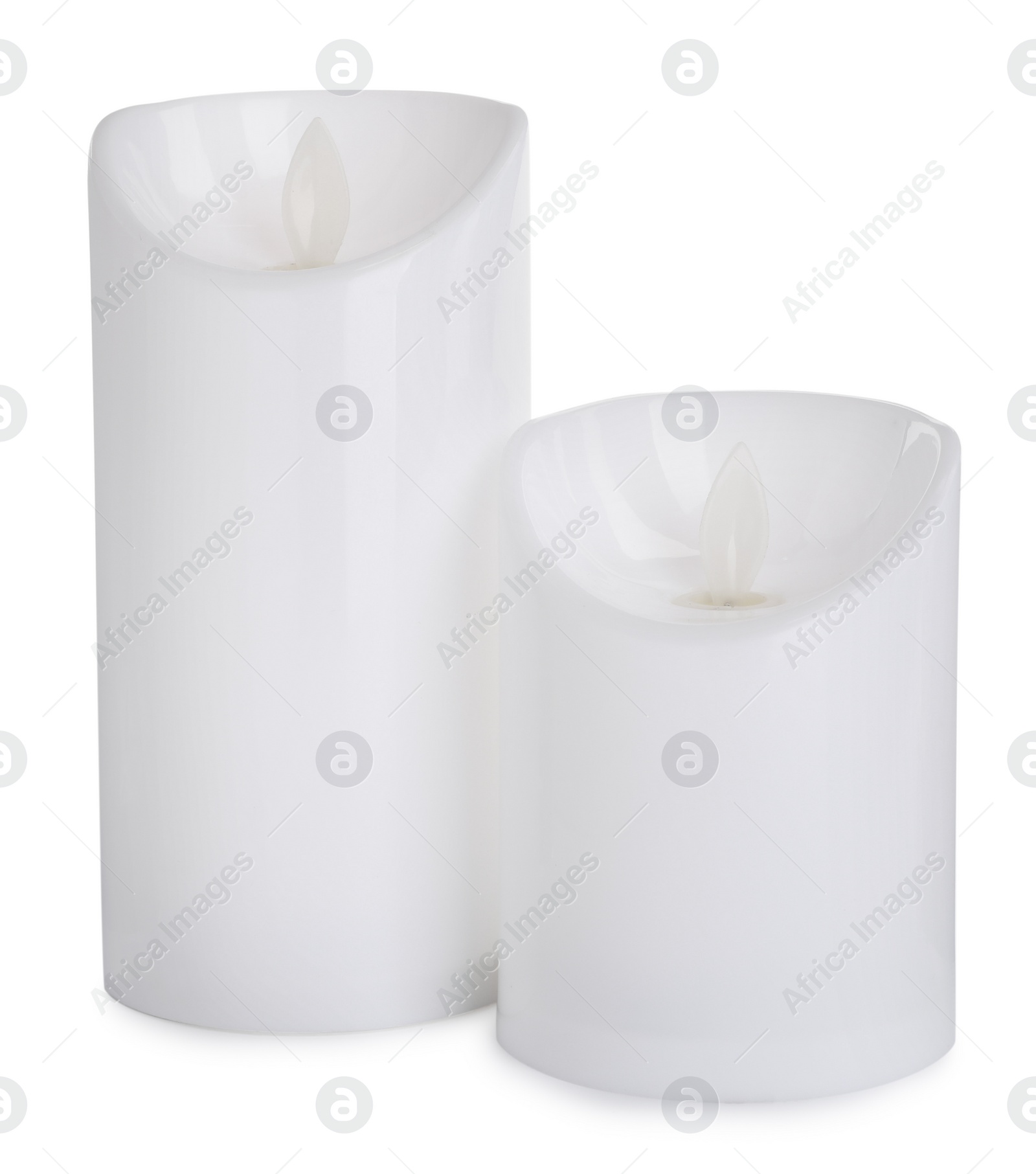 Decorative flameless LED candles on white background Photo of Decorative flameless LED candles on white background