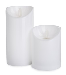 Decorative flameless LED candles on white background Photo of Decorative flameless LED candles on white background