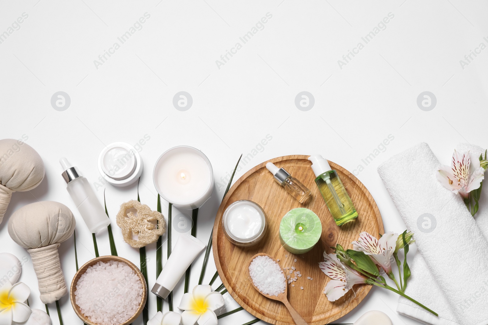 Flat lay composition with spa essentials on white background. Space for text Photo of Flat lay composition with spa essentials on white background. Space for text