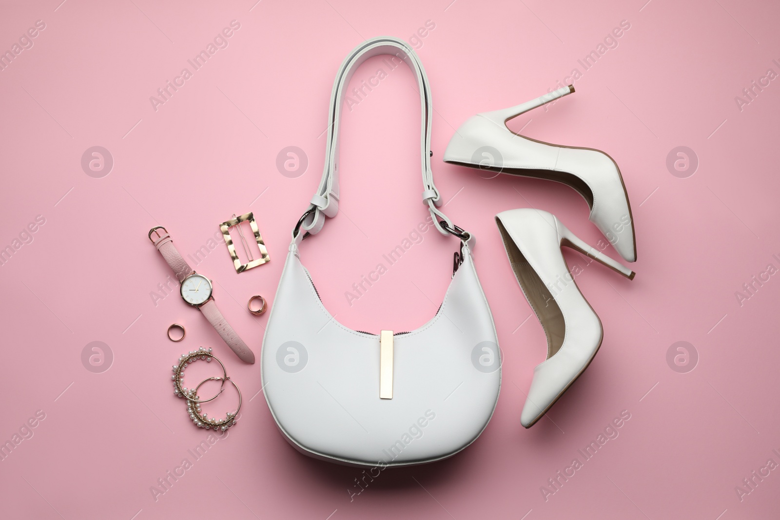 Stylish woman's bag, shoes and accessories on pink background, flat lay Photo of Stylish woman's bag, shoes and accessories on pink background, flat lay