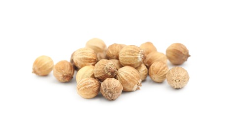 Photo of Scattered dried coriander seeds on white background, closeup