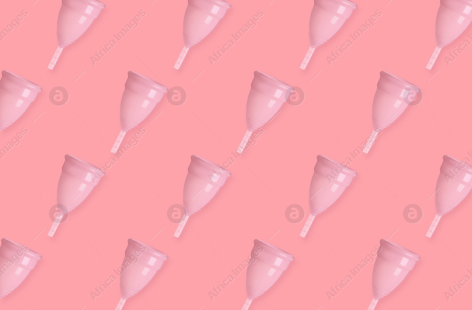 Many menstrual cups on pink background, flat lay. Pattern design Image of Many menstrual cups on pink background, flat lay. Pattern design