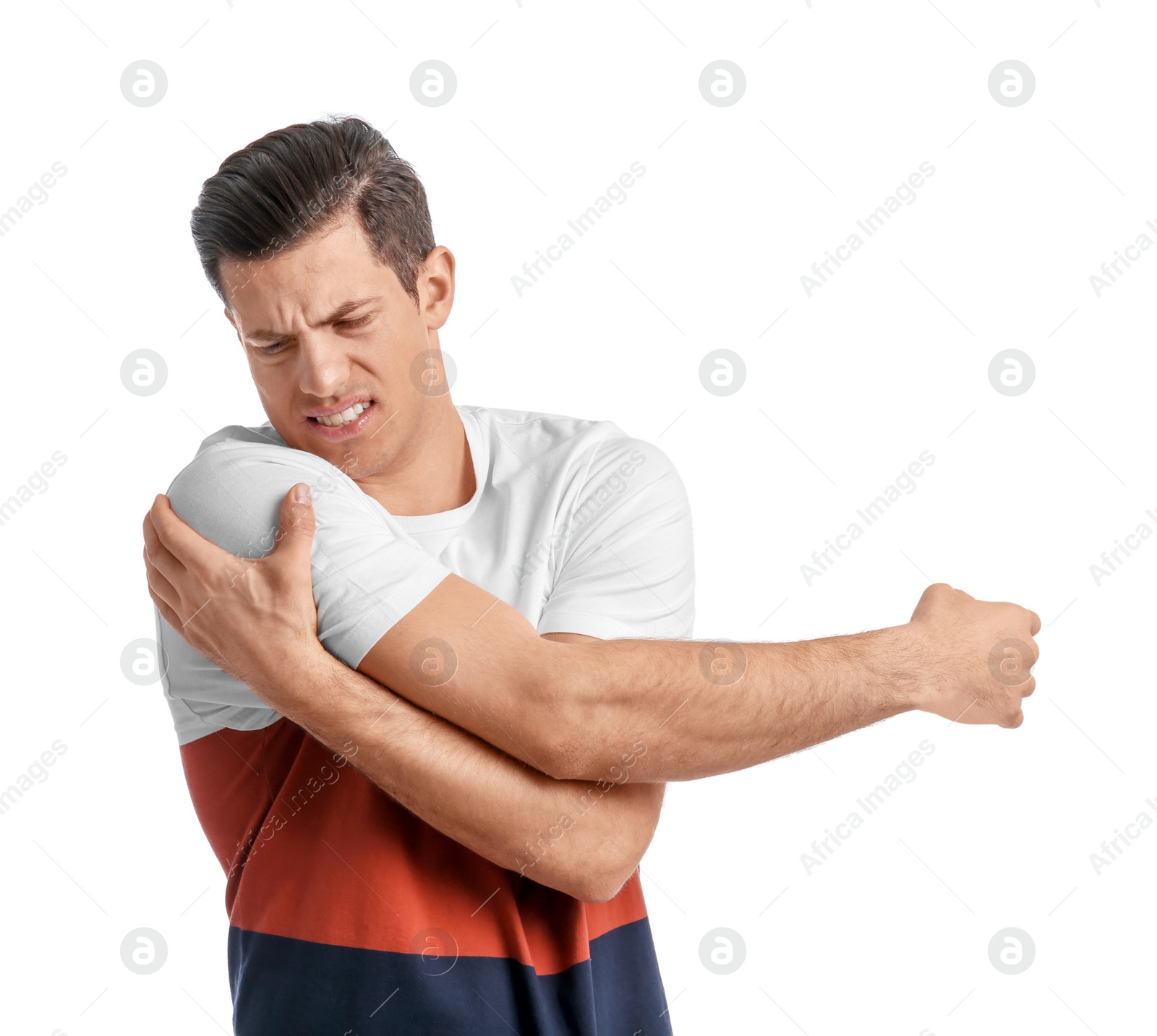 Young man suffering from pain in shoulder on white background Photo of Young man suffering from pain in shoulder on white background