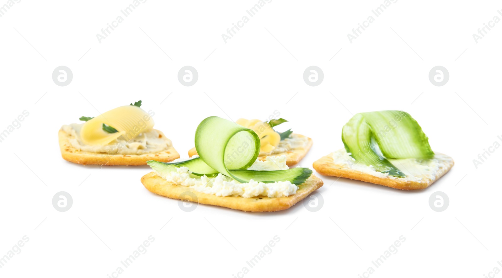 Delicious crackers with humus and cheese on white background Photo of Delicious crackers with humus and cheese on white background