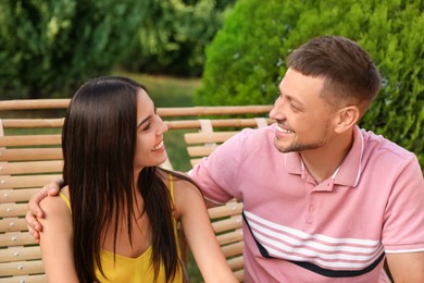 Happy couple resting in deck chairs outdoors Image of Happy couple resting in deck chairs outdoors