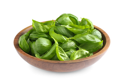 Photo of Fresh basil leaves in wooden bowl isolated on white