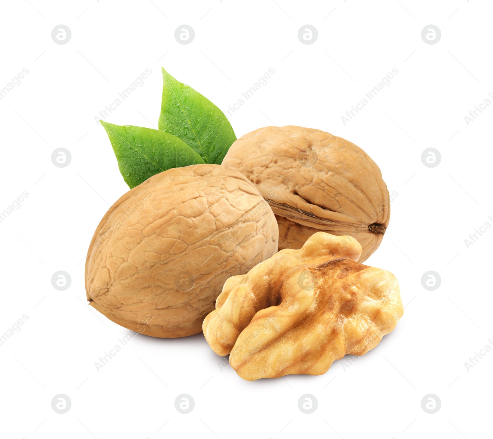 Tasty walnuts and green leaves on white background Image of Tasty walnuts and green leaves on white background