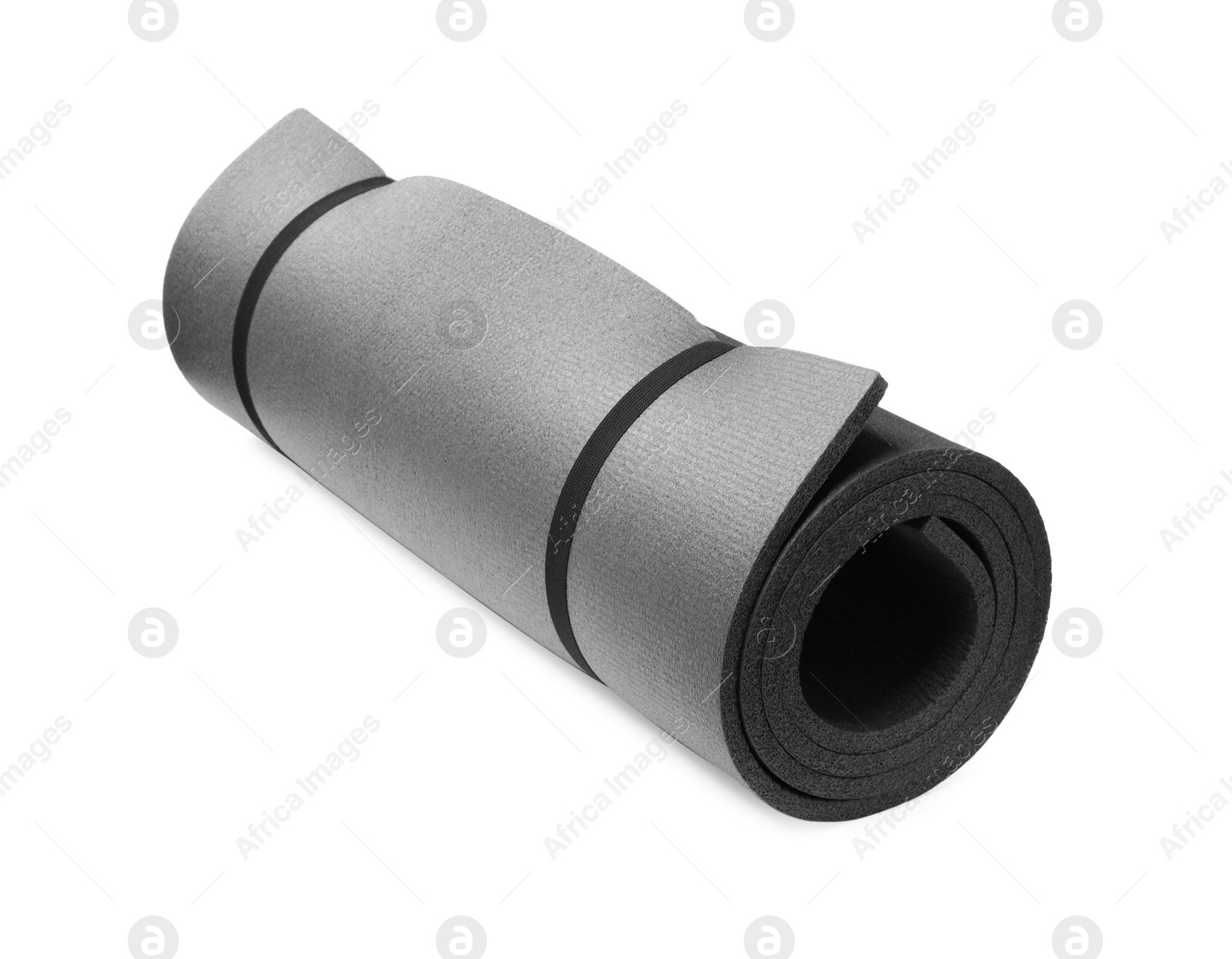Rolled grey camping mat isolated on white Photo of Rolled grey camping mat isolated on white