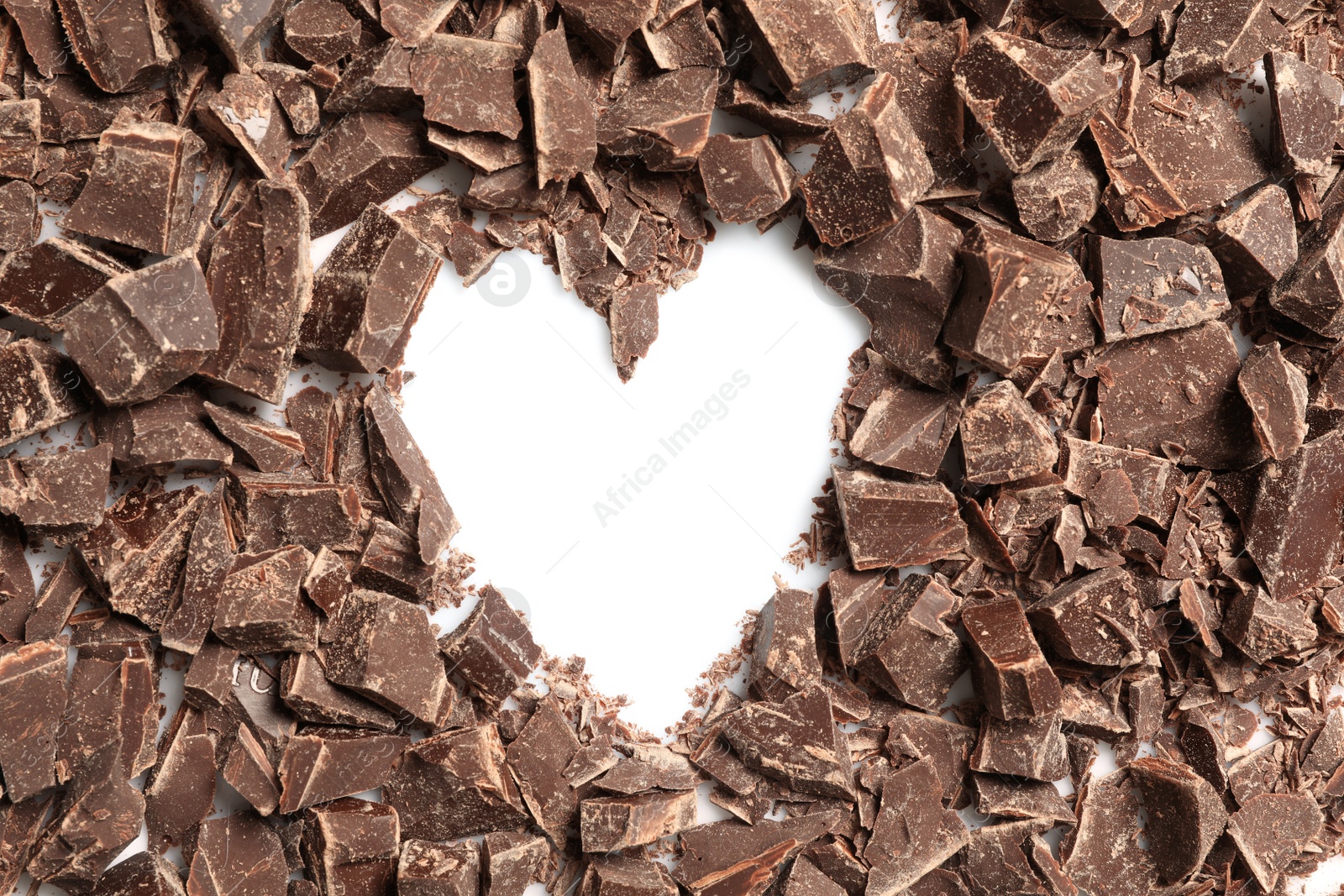 Photo of Heart made with dark chocolate crumbles on white background, top view