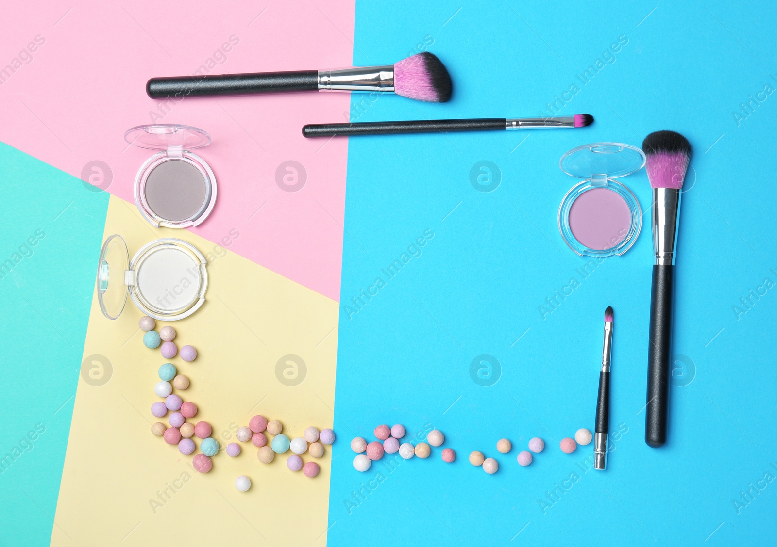 Decorative makeup products on color background Photo of Decorative makeup products on color background