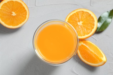Glass of orange juice and fresh fruits on table, top view Photo of Glass of orange juice and fresh fruits on table, top view