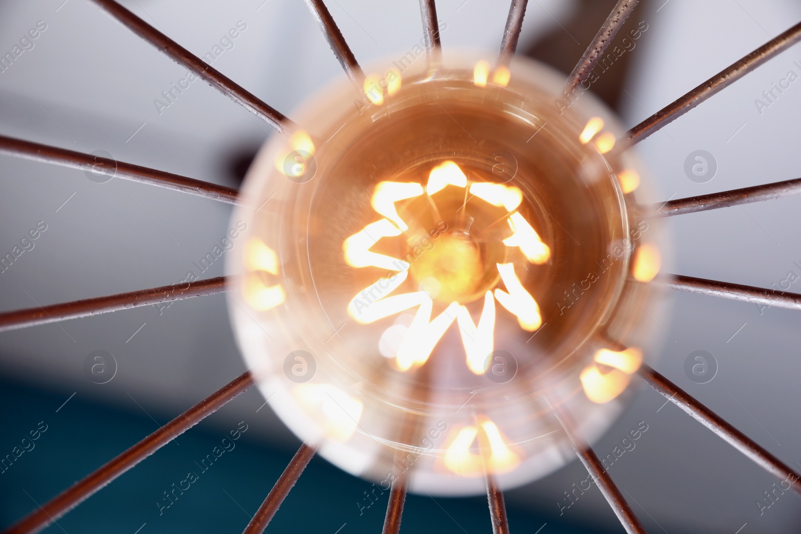 Stylish metallic pendant lamp with Edison light bulb indoors, bottom view Image of Stylish metallic pendant lamp with Edison light bulb indoors, bottom view