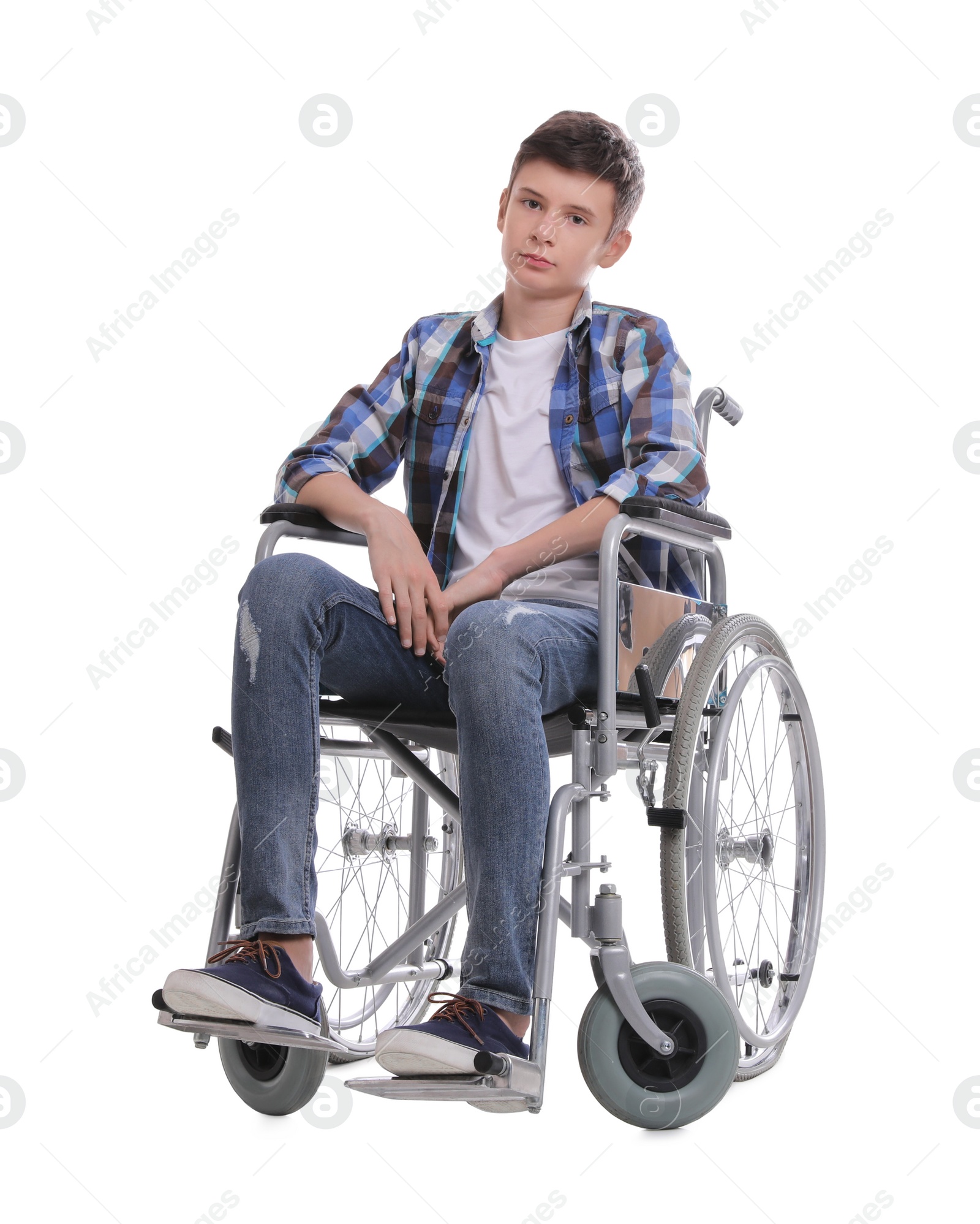 Teen boy in wheelchair on white background Photo of Teen boy in wheelchair on white background