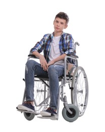 Teen boy in wheelchair on white background Photo of Teen boy in wheelchair on white background