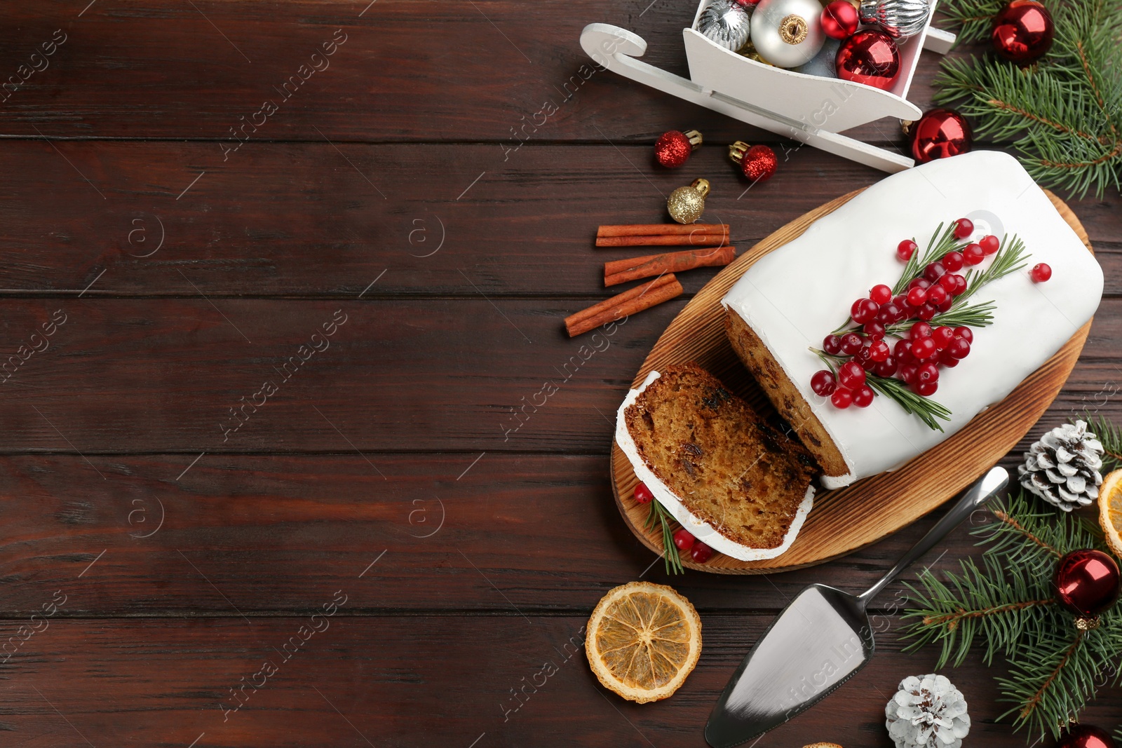 Flat lay composition with traditional classic Christmas cake on wooden table. Space for text Photo of Flat lay composition with traditional classic Christmas cake on wooden table. Space for text
