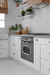 Photo of Beautiful kitchen interior with new stylish furniture