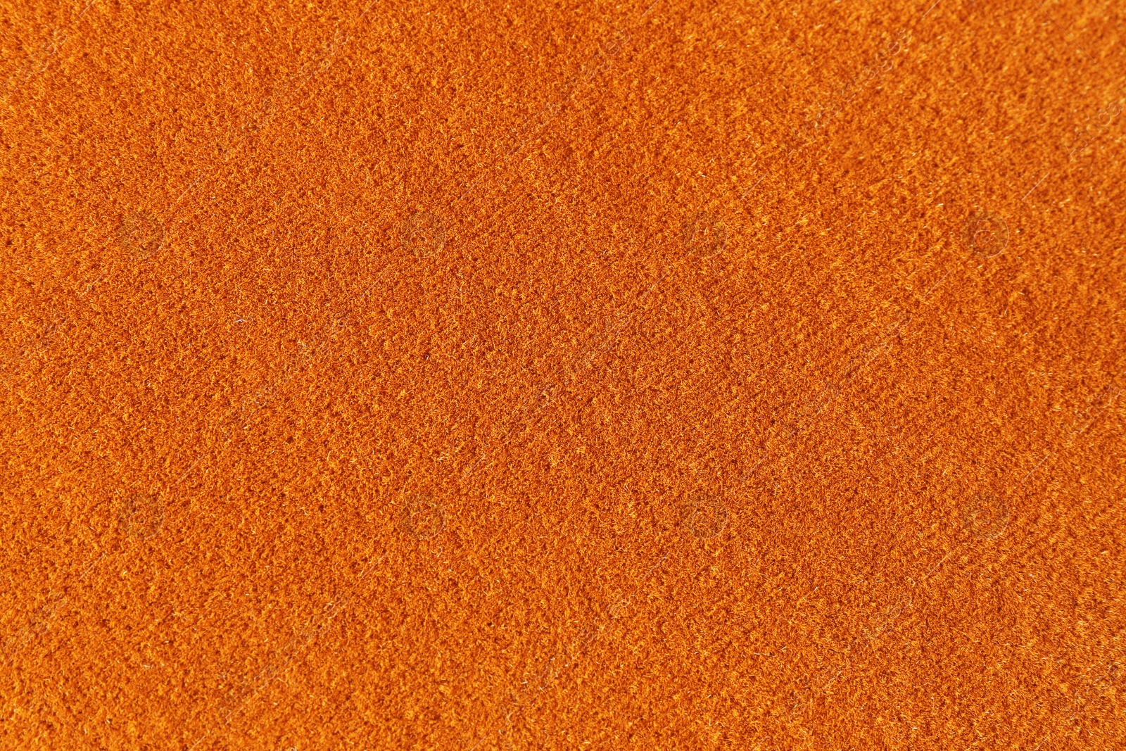Orange textured surface as background, closeup view Photo of Orange textured surface as background, closeup view