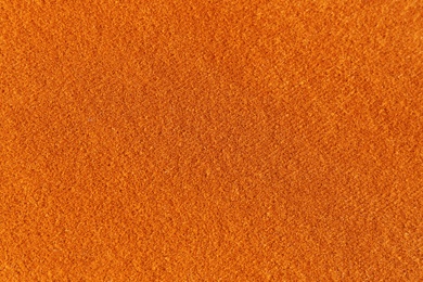 Orange textured surface as background, closeup view Photo of Orange textured surface as background, closeup view