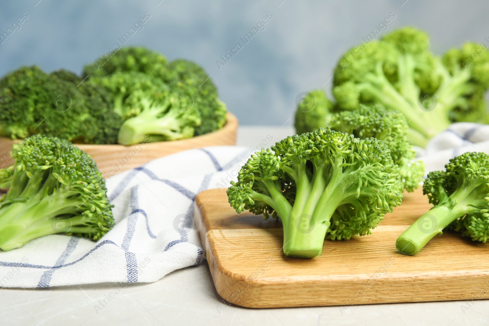 Fresh green broccoli on light marble table Photo of Fresh green broccoli on light marble table
