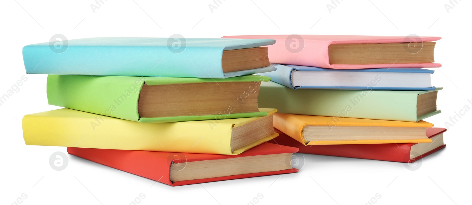 Many colorful hardcover books on white background Photo of Many colorful hardcover books on white background
