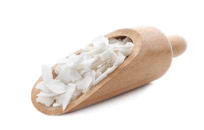 Wooden scoop with coconut flakes on white background Photo of Wooden scoop with coconut flakes on white background