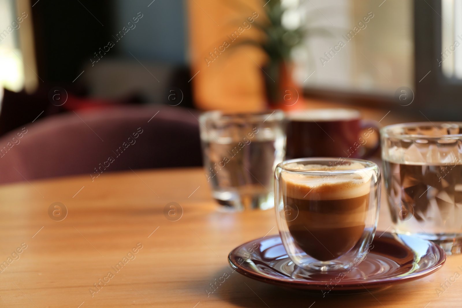 Aromatic coffee on wooden table in cafe. Space for text Photo of Aromatic coffee on wooden table in cafe. Space for text