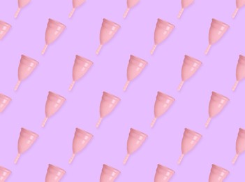 Many menstrual cups on pink background, flat lay. Pattern design Image of Many menstrual cups on pink background, flat lay. Pattern design