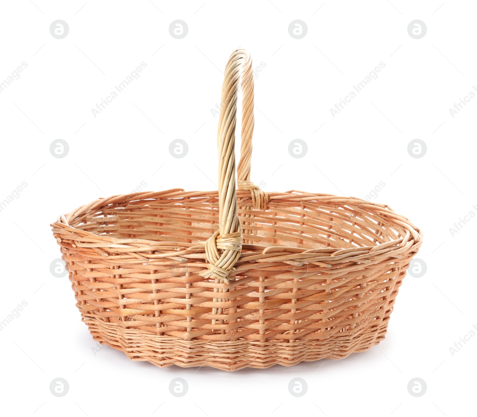 Wicker basket with handle isolated on white Photo of Wicker basket with handle isolated on white
