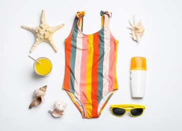 Flat lay composition with beach objects on white background Photo of Flat lay composition with beach objects on white background