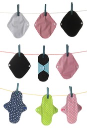 Many different cloth menstrual pads hanging on laundry line, white background Image of Many different cloth menstrual pads hanging on laundry line, white background