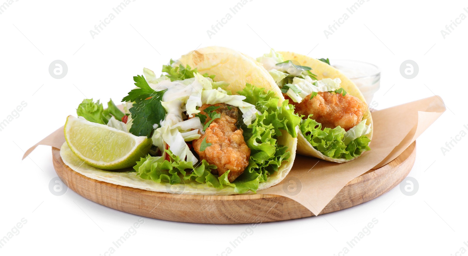 Yummy fish tacos with lettuce isolated on white Photo of Yummy fish tacos with lettuce isolated on white