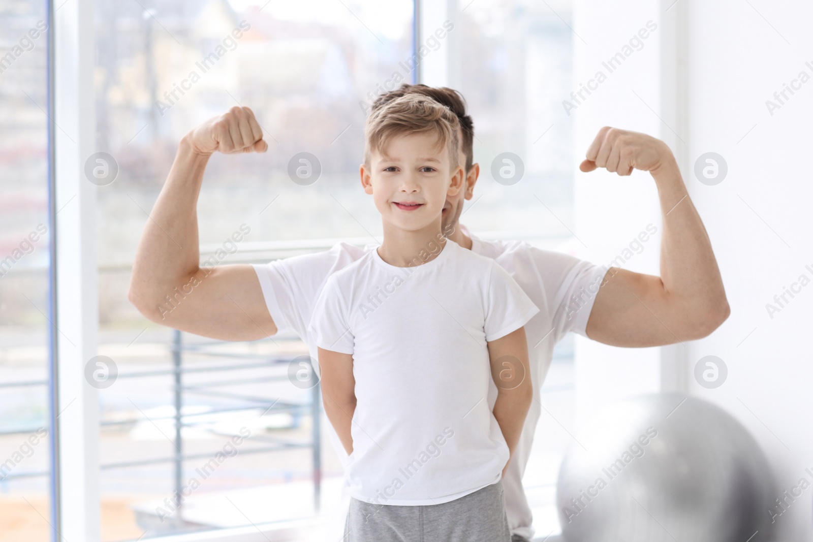 Photo of Dad and his son in gym