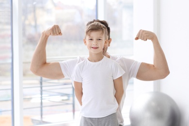 Photo of Dad and his son in gym