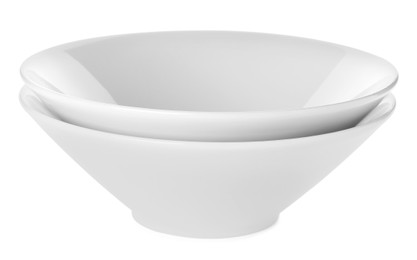 Empty clean ceramic bowls isolated on white Photo of Empty clean ceramic bowls isolated on white