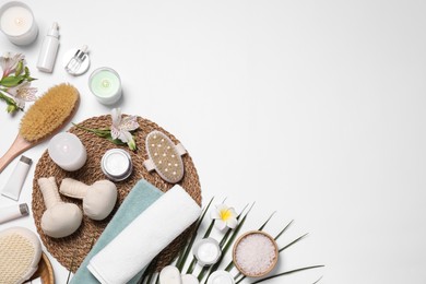 Flat lay composition with spa essentials on white background. Space for text Photo of Flat lay composition with spa essentials on white background. Space for text
