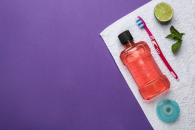 Composition with mouthwash and other oral hygiene products on purple background, top view. Space for text Photo of Composition with mouthwash and other oral hygiene products on purple background, top view. Space for text