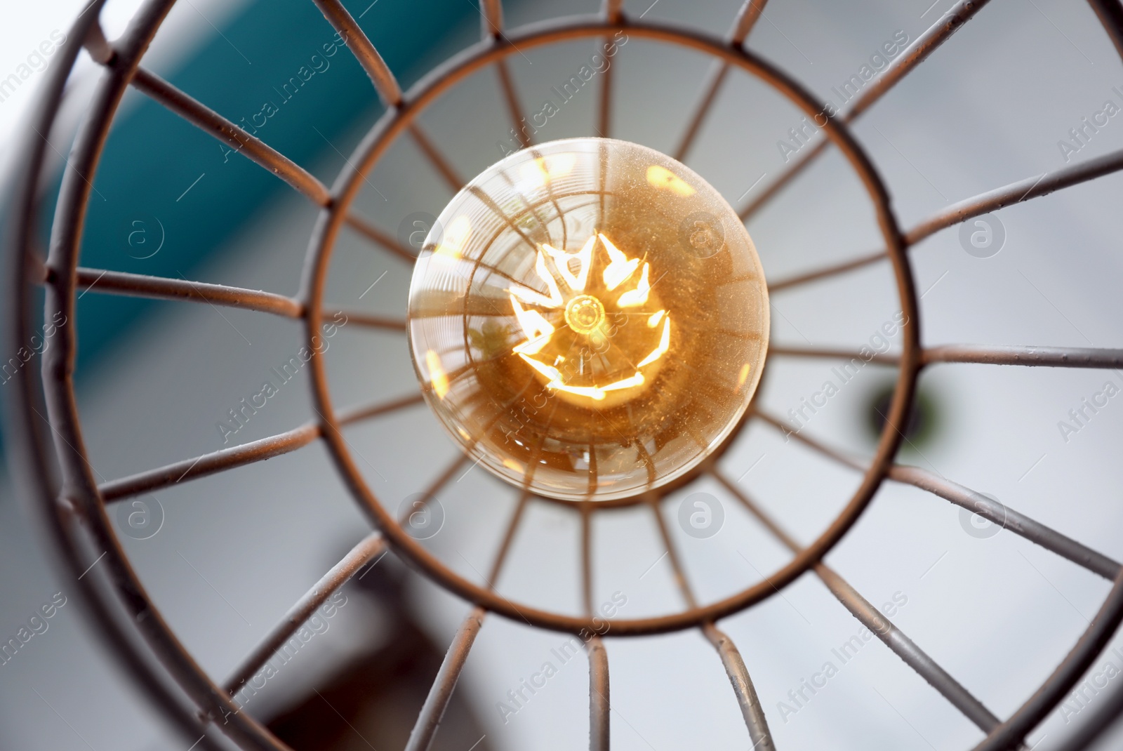 Stylish metallic pendant lamp with Edison light bulb indoors, bottom view Image of Stylish metallic pendant lamp with Edison light bulb indoors, bottom view