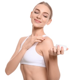 Young woman with jar of body cream on white background Photo of Young woman with jar of body cream on white background
